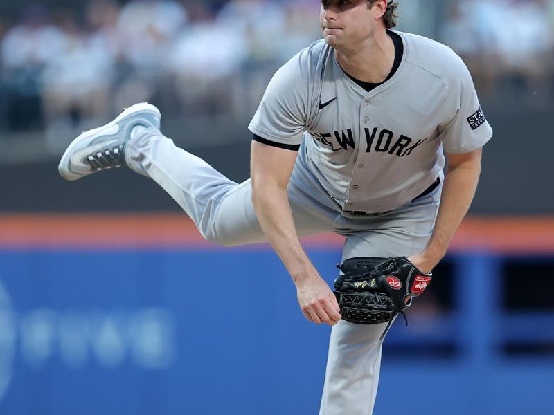 Jun 25, 2024; New York City, New York, USA; New York Yankees starting pitcher Gerrit Cole (45) follows through on a pitch against the New York Mets during the first inning at Citi Field. Mandatory Credit: Brad Penner-USA TODAY Sports