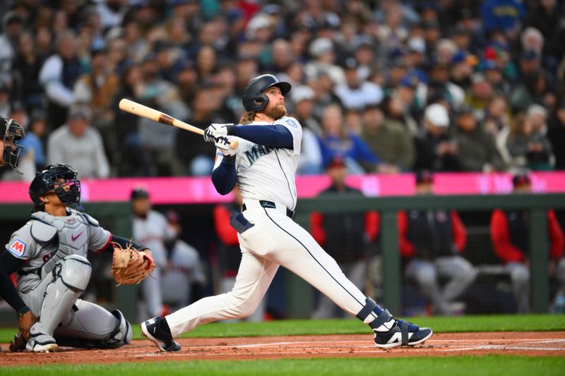 Mar 26, 2026; Seattle, Washington, USA; Seattle Mariners third baseman Brendan Donovan (33) hits a home run against the Cleveland Guardians during the first inning at T-Mobile Park. Mandatory Credit: Steven Bisig-Imagn Images