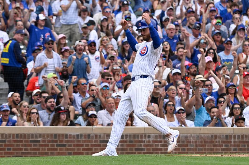 Jun 15, 2024; Chicago, Illinois, USA;  Chicago Cubs outfielder Cody Bellinger (24) scores against the St. Louis Cardinals during the fourth inning at Wrigley Field. Mandatory Credit: Matt Marton-USA TODAY Sports