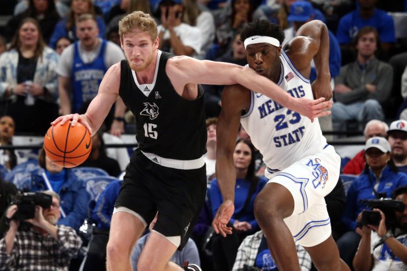 Jan 31, 2024; Memphis, Tennessee, USA; Rice Owls forward Max Fiedler (15) dribbles as Memphis Tigers guard Jayden Hardaway (25) defends during the second half at FedExForum. Mandatory Credit: Petre Thomas-USA TODAY Sports