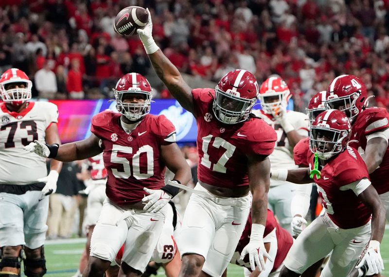 Dec 2, 2023; Atlanta, GA, USA;  Alabama Crimson Tide linebacker Trezmen Marshall (17) celebrates after recovering a Georgia fumble at Mercedes-Benz Stadium. Alabama defeated Georgia 27-24 to claim the SEC Championship. Mandatory Credit: Gary Cosby Jr.-USA TODAY Sports