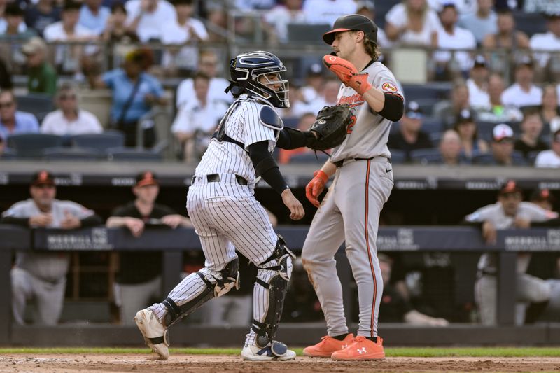 Jun 20, 2024; Bronx, New York, USA; New York Yankees catcher Jose Trevino (39) tags out Baltimore Orioles shortstop Gunnar Henderson (2) at home plate during the fifth inning at Yankee Stadium. Mandatory Credit: John Jones-USA TODAY Sports