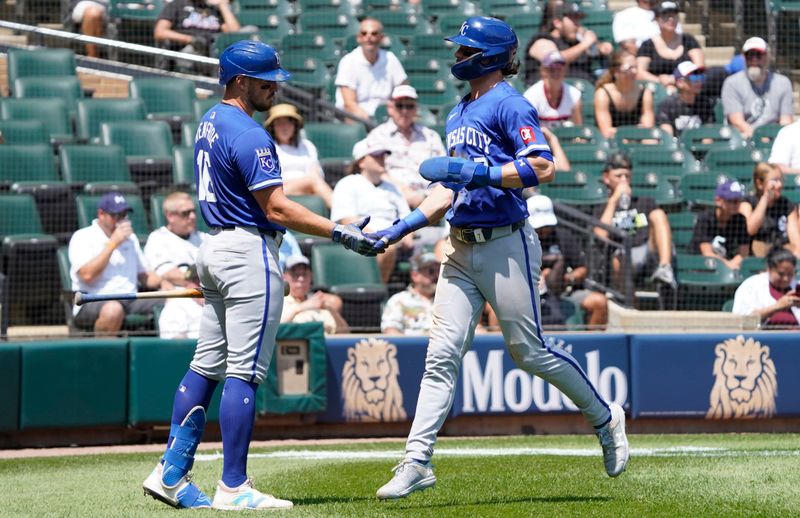 Jul 31, 2024; Chicago, Illinois, USA; Kansas City Royals shortstop Bobby Witt Jr. (7) celebrates with outfielder Hunter Renfroe (16) after scoring against the Chicago White Sox during the third inning at Guaranteed Rate Field. Mandatory Credit: David Banks-USA TODAY Sports