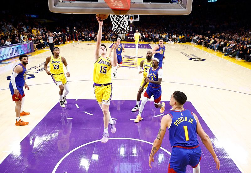 LOS ANGELES, CALIFORNIA - APRIL 25:  Austin Reaves #15 of the Los Angeles Lakers takes a shot against the Denver Nuggets during game three of the Western Conference First Round Playoffs at Crypto.com Arena on April 25, 2024 in Los Angeles, California.  NOTE TO USER: User expressly acknowledges and agrees that, by downloading and/or using this photograph, user is consenting to the terms and conditions of the Getty Images License Agreement.  (Photo by Ronald Martinez/Getty Images)