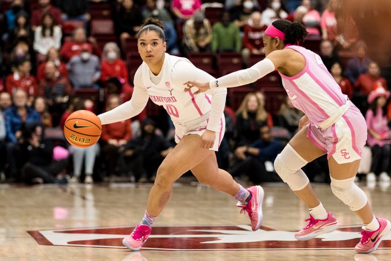 Feb 17, 2023; Stanford, California, USA;  Stanford Cardinal guard Talana Lepolo (10) drives past USC Trojans guard Kayla Williams (4) during the first half at Maples Pavilion. Mandatory Credit: John Hefti-USA TODAY Sports