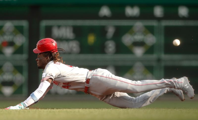 Aug 13, 2023; Pittsburgh, PA, USA; Cincinnati Reds shortstop Elly De La Cruz (44) beats the ball to the base on a steal of second base against the Pittsburgh Pirates during the first inning at PNC Park. Mandatory Credit: Charles LeClaire-USA TODAY Sports