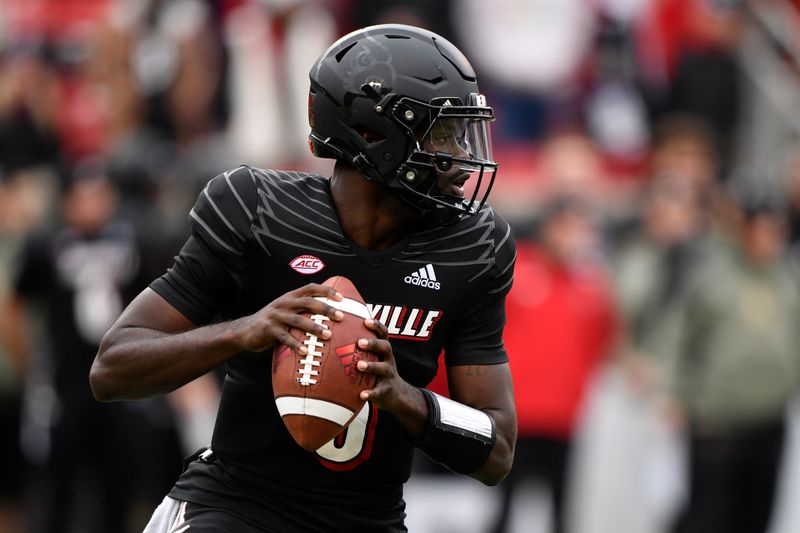 Nov 13, 2021; Louisville, Kentucky, USA;  Louisville Cardinals quarterback Malik Cunningham (3) looks to pass against the Syracuse Orange during the first quarter at Cardinal Stadium. Mandatory Credit: Jamie Rhodes-USA TODAY Sports