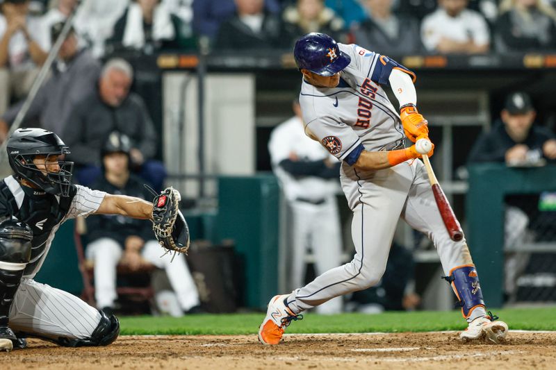 May 13, 2023; Chicago, Illinois, USA; Houston Astros shortstop Jeremy Pena (3) singles against the Chicago White Sox during the ninth inning at Guaranteed Rate Field. Mandatory Credit: Kamil Krzaczynski-USA TODAY Sports