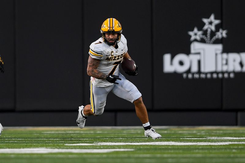 Sep 30, 2023; Nashville, Tennessee, USA;  Missouri Tigers running back Cody Schrader (7) runs the ball against the Vanderbilt Commodores during the second half at FirstBank Stadium. Mandatory Credit: Steve Roberts-USA TODAY Sports