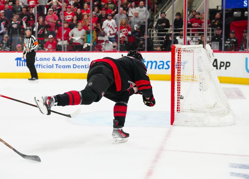 May 12, 2025; Raleigh, North Carolina, USA; Carolina Hurricanes right wing Andrei Svechnikov (37) scores a empty net goal against the Washington Capitals during the third period in game four of the second round of the 2025 Stanley Cup Playoffs at Lenovo Center. Mandatory Credit: James Guillory-Imagn Images