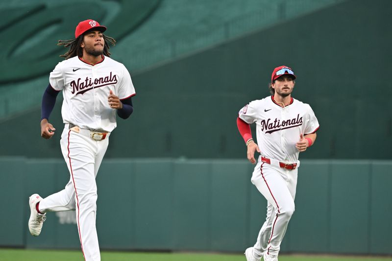 Aug 26, 2024; Washington, District of Columbia, USA; Washington Nationals left fielder James Wood (29) and center fielder Dylan Crews (3) warm up before a game against the New York Yankees at Nationals Park. Mandatory Credit: Rafael Suanes-USA TODAY Sports