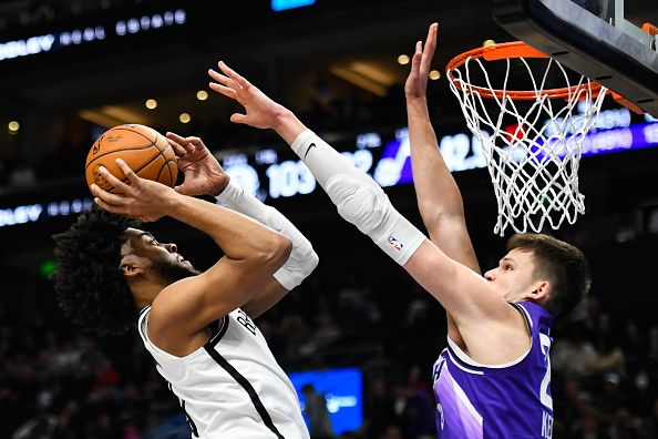 SALT LAKE CITY, UTAH - DECEMBER 18: Trendon Watford #9 of the Brooklyn Nets shoots the ball against Walker Kessler #24 of the Utah Jazz during the second half of a game at Delta Center on December 18, 2023 in Salt Lake City, Utah. NOTE TO USER: User expressly acknowledges and agrees that, by downloading and or using this photograph, User is consenting to the terms and conditions of the Getty Images License Agreement. (Photo by Alex Goodlett/Getty Images)