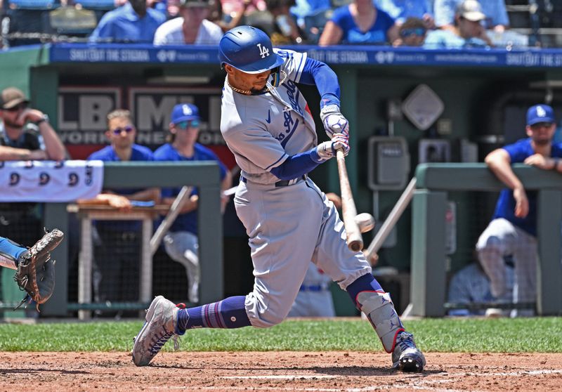 Jul 2, 2023; Kansas City, Missouri, USA;  Los Angeles Dodgers shortstop Mookie Betts (50) doubles in the fifth inning against the Kansas City Royals at Kauffman Stadium. Mandatory Credit: Peter Aiken-USA TODAY Sports