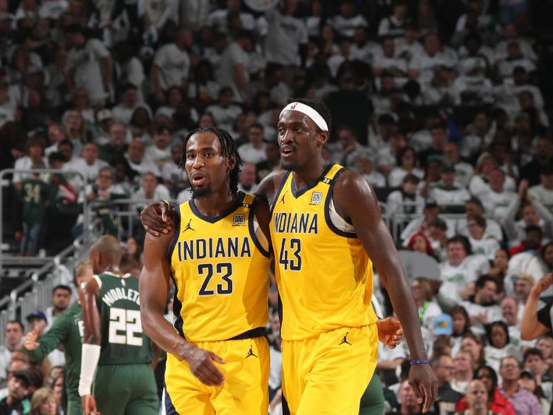 MILWAUKEE, WI - APRIL 23: Aaron Nesmith #23 of the Indiana Pacers and Pascal Siakam #43 of the Indiana Pacers embrace during the game against the Milwaukee Bucks during Round One Game Two of the 2024 NBA Playoffs on April 23, 2024 at the Fiserv Forum Center in Milwaukee, Wisconsin. NOTE TO USER: User expressly acknowledges and agrees that, by downloading and or using this Photograph, user is consenting to the terms and conditions of the Getty Images License Agreement. Mandatory Copyright Notice: Copyright 2024 NBAE (Photo by Gary Dineen/NBAE via Getty Images).