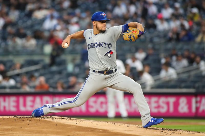 Apr 13, 2022; Bronx, New York, USA;  Toronto Blue Jays starting pitcher Jose Berrios (17) pitches in the first inning against the New York Yankees at Yankee Stadium. Mandatory Credit: Wendell Cruz-USA TODAY Sports