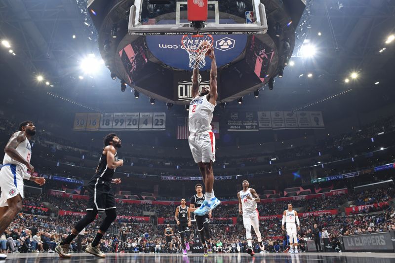 LOS ANGELES, CA - JANUARY 21: Kawhi Leonard #2 of the LA Clippers dunks the ball during the game against the Brooklyn Nets on January 21, 2024 at Crypto.Com Arena in Los Angeles, California. NOTE TO USER: User expressly acknowledges and agrees that, by downloading and/or using this Photograph, user is consenting to the terms and conditions of the Getty Images License Agreement. Mandatory Copyright Notice: Copyright 2024 NBAE (Photo by Adam Pantozzi/NBAE via Getty Images)