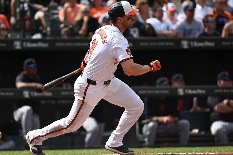 Sep 22, 2024; Baltimore, Maryland, USA;  Baltimore Orioles second  baseman Jordan Westburg (11)swings through a rbi double during fifth inning against the Detroit Tigers at Oriole Park at Camden Yards. Mandatory Credit: Tommy Gilligan-Imagn Images