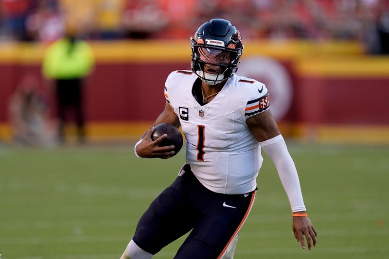 Chicago Bears quarterback Justin Fields runs the ball during the second half of an NFL football game against the Kansas City Chiefs Sunday, Sept. 24, 2023, in Kansas City, Mo. (AP Photo/Charlie Riedel)