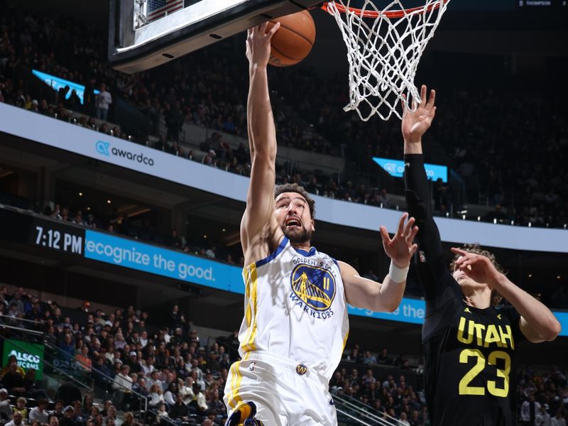 SALT LAKE CITY, UT - FEBRUARY 12: Klay Thompson #11 of the Golden State Warriors drives to the basket during the game against the Utah Jazz on February 12, 2024 at Delta Center in Salt Lake City, Utah. NOTE TO USER: User expressly acknowledges and agrees that, by downloading and or using this Photograph, User is consenting to the terms and conditions of the Getty Images License Agreement. Mandatory Copyright Notice: Copyright 2024 NBAE (Photo by Melissa Majchrzak/NBAE via Getty Images)