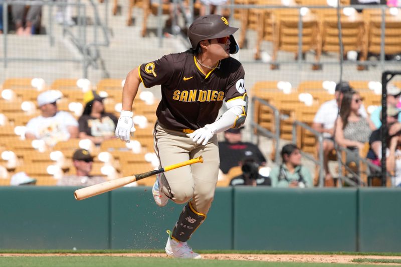 Feb 28, 2024; Phoenix, Arizona, USA; San Diego Padres shortstop Ha-Seong Kim (7) hits a single against the Chicago White Sox in the third inning at Camelback Ranch-Glendale. Mandatory Credit: Rick Scuteri-USA TODAY Sports