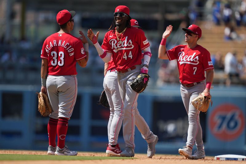 Jul 30, 2023; Los Angeles, California, USA; Cincinnati Reds third baseman Elly De La Cruz (44) celebrates with first baseman Christian Encarnacion-Strand (33) and first baseman Spencer Steer (7) after the game against the Los Angeles Dodgers at Dodger Stadium. Mandatory Credit: Kirby Lee-USA TODAY Sports