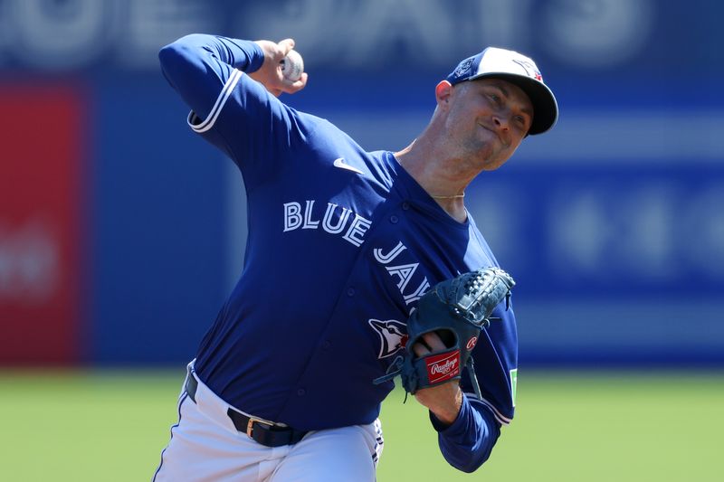 Mar 4, 2024; Dunedin, Florida, USA;  Toronto Blue Jays relief pitcher Trevor Richards (33) throws a pitch against the Philadelphia Phillies in the third inning at TD Ballpark. Mandatory Credit: Nathan Ray Seebeck-USA TODAY Sports