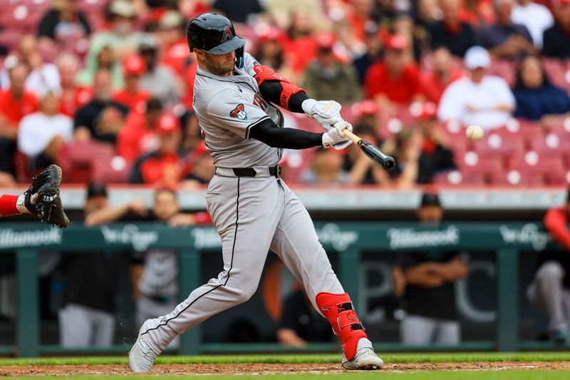 May 9, 2024; Cincinnati, Ohio, USA; Arizona Diamondbacks first baseman Christian Walker (53) hits a RBI single against the Cincinnati Reds in the seventh inning at Great American Ball Park. Mandatory Credit: Katie Stratman-USA TODAY Sports