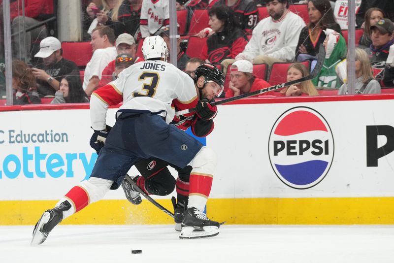 May 20, 2025; Raleigh, North Carolina, USA; Florida Panthers defenseman Seth Jones (3) checks a Carolina Hurricanes player during the third period in game one of the Eastern Conference Final of the 2025 Stanley Cup Playoffs at Lenovo Center. Mandatory Credit: James Guillory-Imagn Images