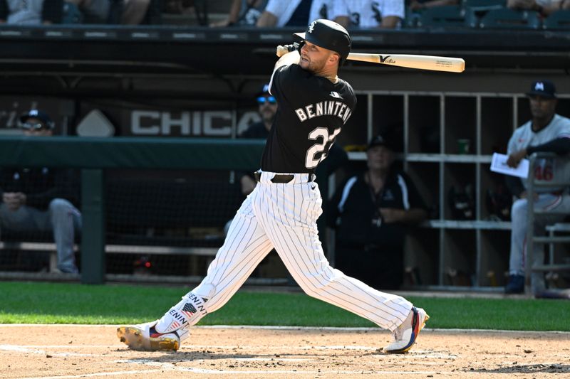 Jul 10, 2024; Chicago, Illinois, USA;  Chicago White Sox outfielder Andrew Benintendi (23) hits an RBI double against the Minnesota Twins during the second inning at Guaranteed Rate Field. Mandatory Credit: Matt Marton-USA TODAY Sports