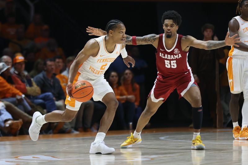 Jan 20, 2024; Knoxville, Tennessee, USA; Tennessee Volunteers guard Jordan Gainey (2) moves the ball against Alabama Crimson Tide guard Aaron Estrada (55) during the second half at Thompson-Boling Arena at Food City Center. Mandatory Credit: Randy Sartin-USA TODAY Sports