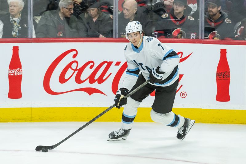 Jan 26, 2025; Ottawa, Ontario, CAN; Utah defenseman Michael Kesselring (7) skates with the puck in the third period against the Ottawa Senators at the Canadian Tire Centre. Mandatory Credit: Marc DesRosiers-Imagn Images