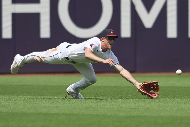 Jun 22, 2023; Cleveland, Ohio, USA; Cleveland Guardians center fielder Myles Straw (7) dives but can not catch a ball hit by Oakland Athletics pinch hitter Tyler Wade (not pictured) during the seventh inning at Progressive Field. Mandatory Credit: Ken Blaze-USA TODAY Sports