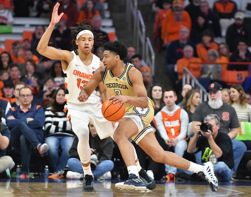 Feb 28, 2023; Syracuse, New York, USA; Georgia Tech Yellow Jackets guard Dallan Coleman (3) drives the ball past Syracuse Orange forward Benny Williams (13) in the second half at the JMA Wireless Dome. Mandatory Credit: Mark Konezny-USA TODAY Sports