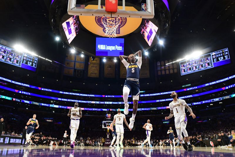 LOS ANGELES, CA - APRIL 27: Kentavious Caldwell-Pope #5 of the Denver Nuggets drives to the basket during the games against the Los Angeles Lakers during Round 1 Game 4 of the 2024 NBA Playoffs on April 27, 2024 at Crypto.Com Arena in Los Angeles, California. NOTE TO USER: User expressly acknowledges and agrees that, by downloading and/or using this Photograph, user is consenting to the terms and conditions of the Getty Images License Agreement. Mandatory Copyright Notice: Copyright 2024 NBAE (Photo by Adam Pantozzi/NBAE via Getty Images)