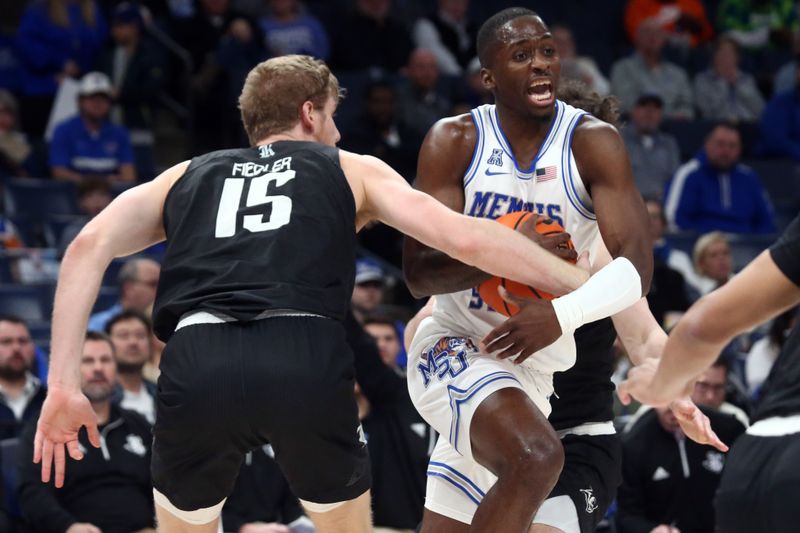 Jan 31, 2024; Memphis, Tennessee, USA; Memphis Tigers forward David Jones (8) drives to the basket as Rice Owls forward Max Fiedler (15) defends during the first half at FedExForum. Mandatory Credit: Petre Thomas-USA TODAY Sports