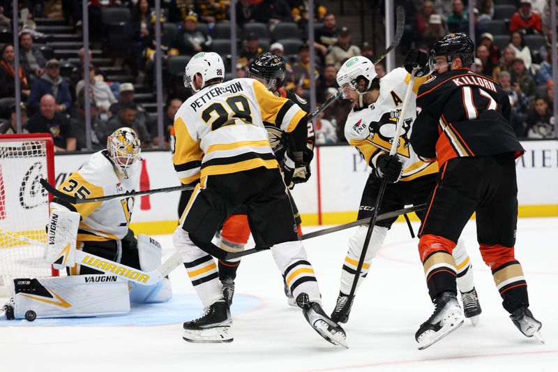 Nov 7, 2023; Anaheim, California, USA; Pittsburgh Penguins defenseman Kris Letang (58) defends Anaheim Ducks left wing Alex Killorn (17) during the second period at Honda Center. Mandatory Credit: Kiyoshi Mio-USA TODAY Sports