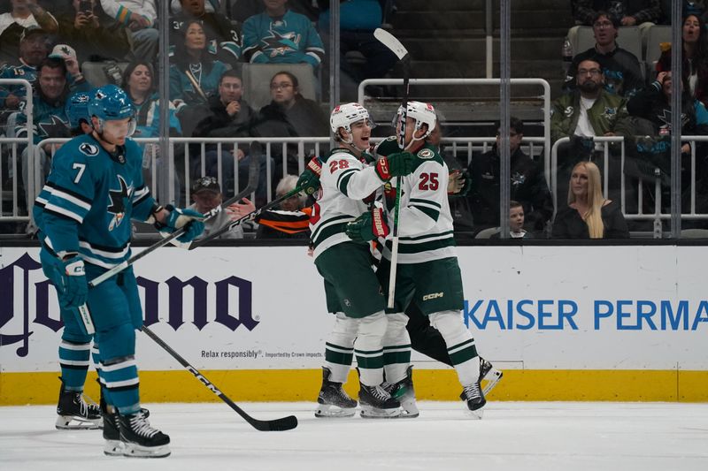 Apr 13, 2024; San Jose, California, USA; Minnesota Wild forward Liam Ohgren (28) celebrates a goal with teammate Minnesota Wild defenseman Jonas Brodin (25) during the second period at SAP Center at San Jose. Mandatory Credit: David Gonzales-USA TODAY Sports