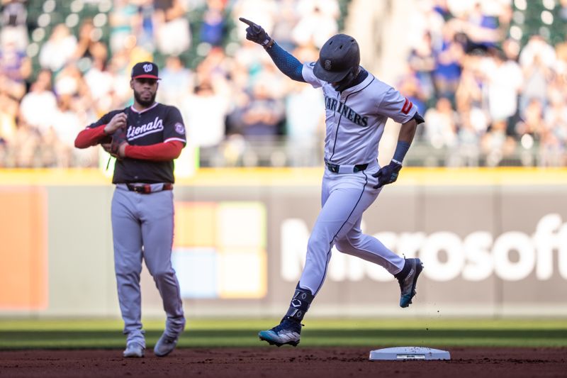 May 27, 2025; Seattle, Washington, USA;  Seattle Mariners centerfielder Julio Rodriguez (44) rounds the balses afteter hitting a two-run home run during the first inning against the Washington Nationals at T-Mobile Park. Mandatory Credit: Stephen Brashear-Imagn Images