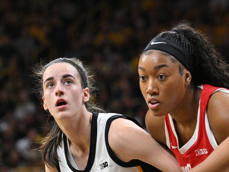 Mar 3, 2024; Iowa City, Iowa, USA; Iowa Hawkeyes guard Caitlin Clark (22) and Ohio State Buckeyes guard Taylor Thierry (2) battle for a rebound during the first quarter at Carver-Hawkeye Arena. Mandatory Credit: Jeffrey Becker-USA TODAY Sports