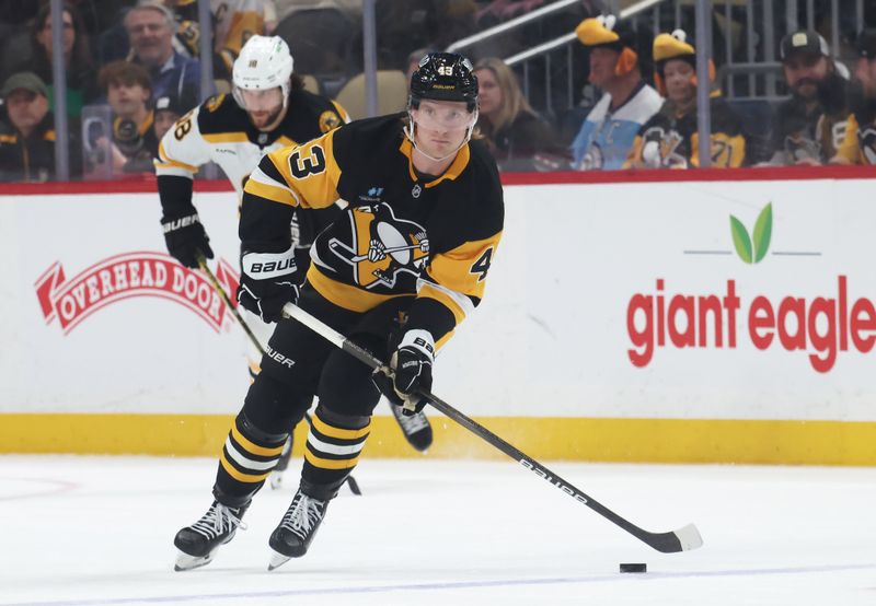 Apr 13, 2025; Pittsburgh, Pennsylvania, USA;  Pittsburgh Penguins left wing Danton Heinen (43) skates with the puck against the Boston Bruins during the third period at PPG Paints Arena. Mandatory Credit: Charles LeClaire-Imagn Images