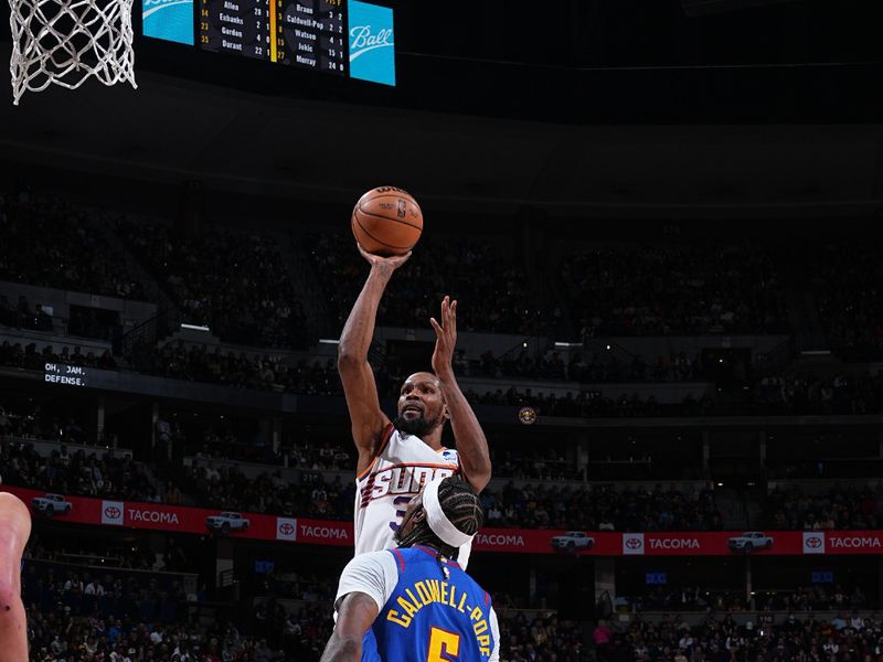 DENVER, CO - MARCH 5: Kevin Durant #35 of the Phoenix Suns shoots the ball during the game against the Denver Nuggetson March 5, 2024 at the Ball Arena in Denver, Colorado. NOTE TO USER: User expressly acknowledges and agrees that, by downloading and/or using this Photograph, user is consenting to the terms and conditions of the Getty Images License Agreement. Mandatory Copyright Notice: Copyright 2024 NBAE (Photo by Garrett Ellwood/NBAE via Getty Images)