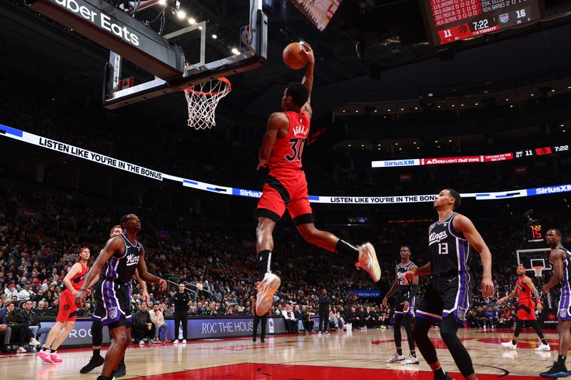 TORONTO, CANADA - MARCH 20: Ochai Agbaji #30 of the Toronto Raptors dunks the ball during the game against the Sacramento Kings on March 20, 2024 at the Scotiabank Arena in Toronto, Ontario, Canada.  NOTE TO USER: User expressly acknowledges and agrees that, by downloading and or using this Photograph, user is consenting to the terms and conditions of the Getty Images License Agreement.  Mandatory Copyright Notice: Copyright 2024 NBAE (Photo by Vaughn Ridley/NBAE via Getty Images)