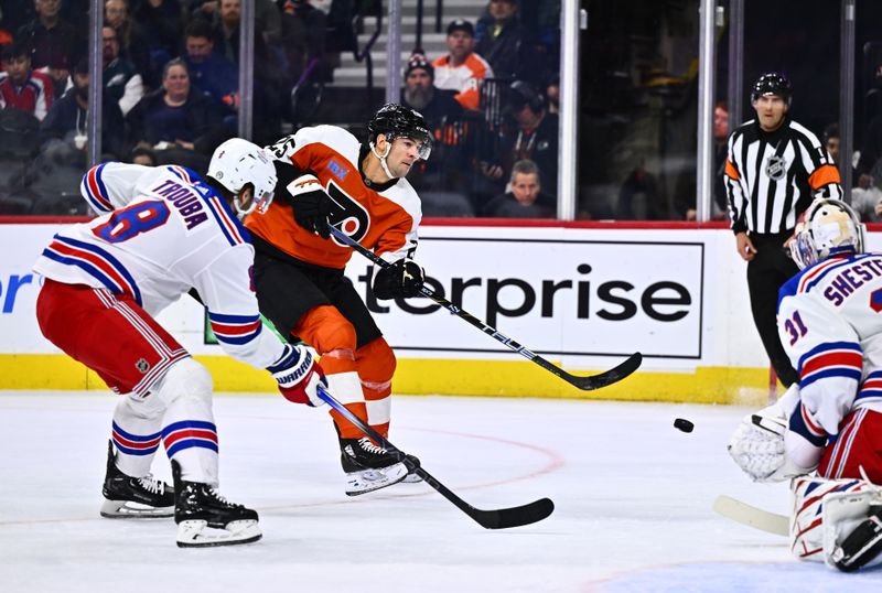 Feb 24, 2024; Philadelphia, Pennsylvania, USA; Philadelphia Flyers center Ryan Poehling (25) shoots across New York Rangers defenseman Jacob Trouba (8) in the first period at Wells Fargo Center. Mandatory Credit: Kyle Ross-USA TODAY Sports