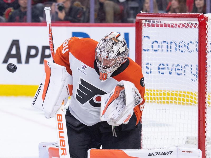 Oct 23, 2025; Ottawa, Ontario, CAN; Philadelphia Flyers goalie Dan Vladar (80) makes a save in the first period against the  Ottawa Senators at the Canadian Tire Centre. Mandatory Credit: Marc DesRosiers-IMAGN Images