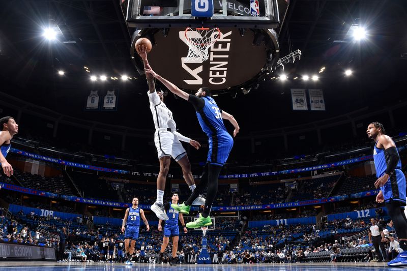 ORLANDO, FL - FEBRUARY 27: Keon Johnson #45 of the Brooklyn Nets drives to the basket during the game against the Orlando Magic on February 27, 2024 at the Kia Center in Orlando, Florida. NOTE TO USER: User expressly acknowledges and agrees that, by downloading and or using this photograph, User is consenting to the terms and conditions of the Getty Images License Agreement. Mandatory Copyright Notice: Copyright 2024 NBAE (Photo by Fernando Medina/NBAE via Getty Images)