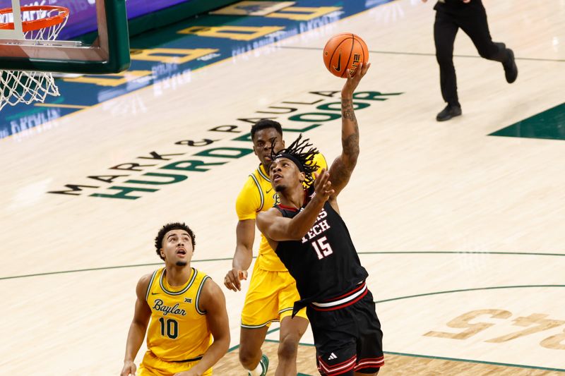 Jan 20, 2026; Waco, Texas, USA;  Texas Tech Red Raiders forward JT Toppin (15) scores a basket ahead of Texas Tech Red Raiders guard Jack Francis (10)vduring the first half at Paul and Alejandra Foster Pavilion. Mandatory Credit: Chris Jones-Imagn Images