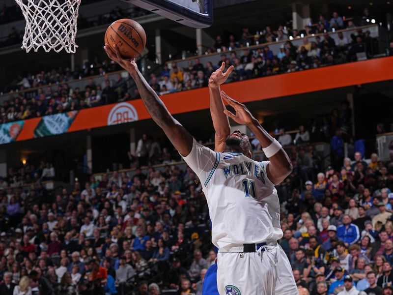 DENVER, CO - MARCH 29: Naz Reid #11 of the Minnesota Timberwolves drives to the basket during the game against the Denver Nuggets on March 29, 2024 at the Ball Arena in Denver, Colorado. NOTE TO USER: User expressly acknowledges and agrees that, by downloading and/or using this Photograph, user is consenting to the terms and conditions of the Getty Images License Agreement. Mandatory Copyright Notice: Copyright 2024 NBAE (Photo by Bart Young/NBAE via Getty Images)