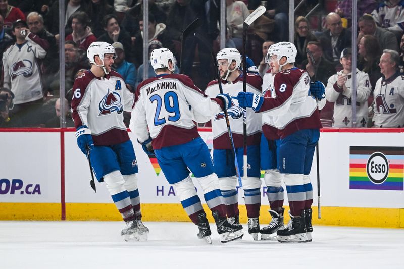 Jan 15, 2024; Montreal, Quebec, CAN; Colorado Avalanche center Ross Colton (20) celebrates his goal against the Montreal Canadiens with his teammates on the ice during the first period at Bell Centre. Mandatory Credit: David Kirouac-USA TODAY Sports