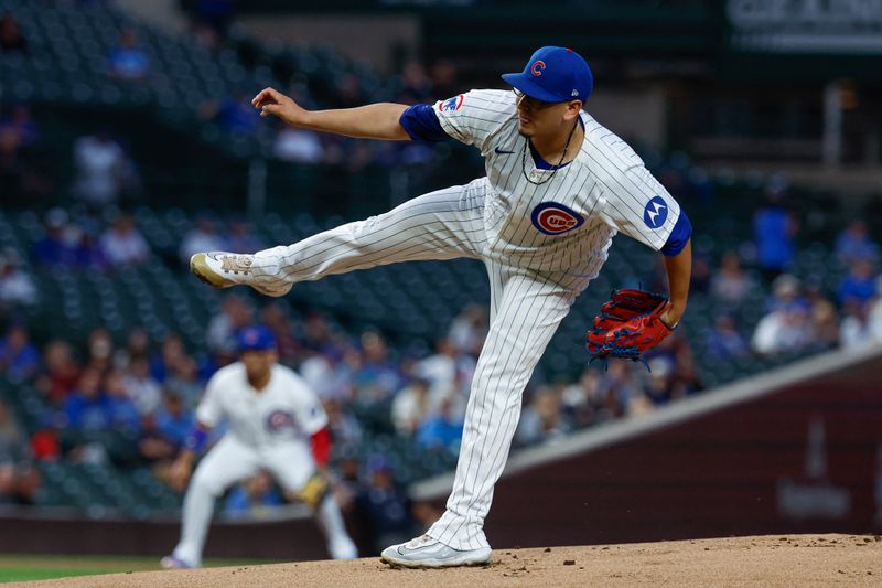 Sep 19, 2024; Chicago, Illinois, USA; Chicago Cubs starting pitcher Javier Assad (72) delivers a pitch against the Washington Nationals during the first inning at Wrigley Field. Mandatory Credit: Kamil Krzaczynski-Imagn Images