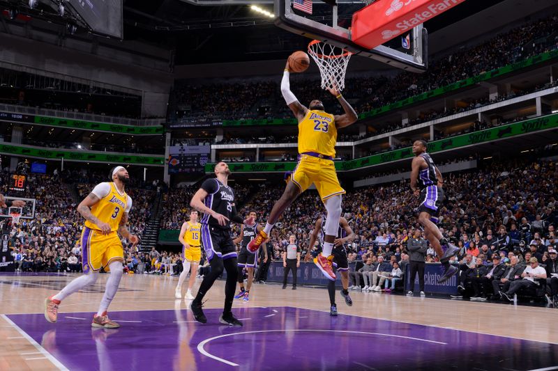 SACRAMENTO, CA - MARCH 13:  LeBron James #23 of the Los Angeles Lakers drives to the basket during the game against the Sacramento Kings on March 13, 2024 at Golden 1 Center in Sacramento, California. NOTE TO USER: User expressly acknowledges and agrees that, by downloading and or using this Photograph, user is consenting to the terms and conditions of the Getty Images License Agreement. Mandatory Copyright Notice: Copyright 2024 NBAE (Photo by Rocky Widner/NBAE via Getty Images)